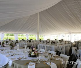 Decorated wedding tent with liner, tables and chairs